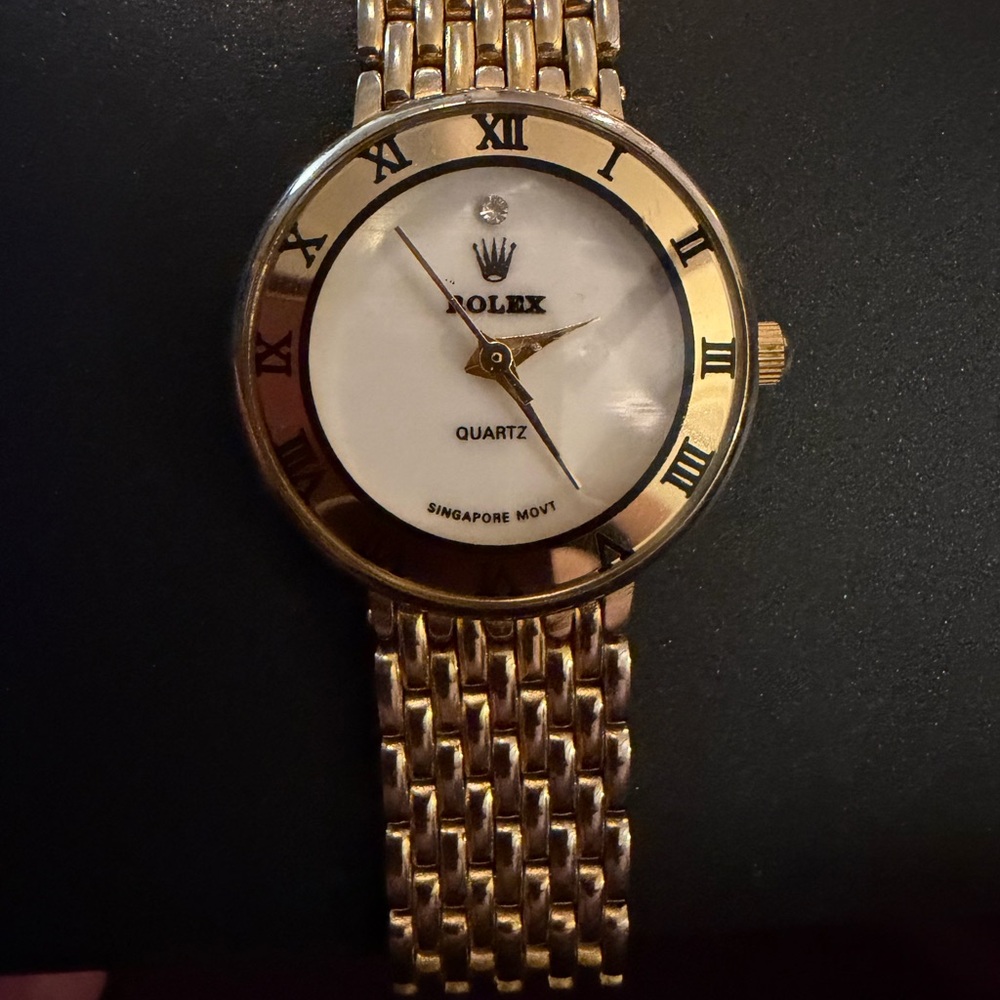 Gold and White Roman Numeral Watch